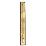 A wall mounted barometer thermometer, 92cms (36ins) high.