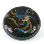 A Chinese cloisonne box and cover of compressed circular form decorated with a phoenix and flowers