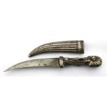 An Indian silver jambiya dagger with patterned blade. Blade length 11.5cms (4.5ins)