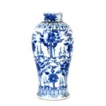 A Chinese blue & white vase decorated with flowers and foliate scrolls, four character blue mark