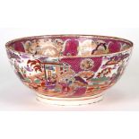 A 19th century porcelain bowl with chinoiserie decoration, 27cms (10.5ins) diameter (a/f).