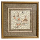A Chinese silk embroidered panel depicting flowers and a bird, framed & glazed, 21 by 21cms (8.25 by