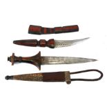 Two African tribal daggers in leather sheaths. Blade lengths of 15cms (5.875ins) and 22cms (8.