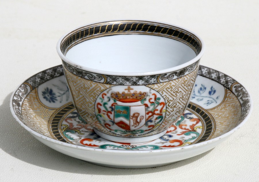 An 18th century Chinese Export tea bowl and saucer decorated with an Armorial crest dated 1783, 4.
