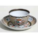 An 18th century Chinese Export tea bowl and saucer decorated with an Armorial crest dated 1783, 4.