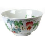 A Chinese famille rose bowl decorated with fruit and flowers, red six-character mark to underside,