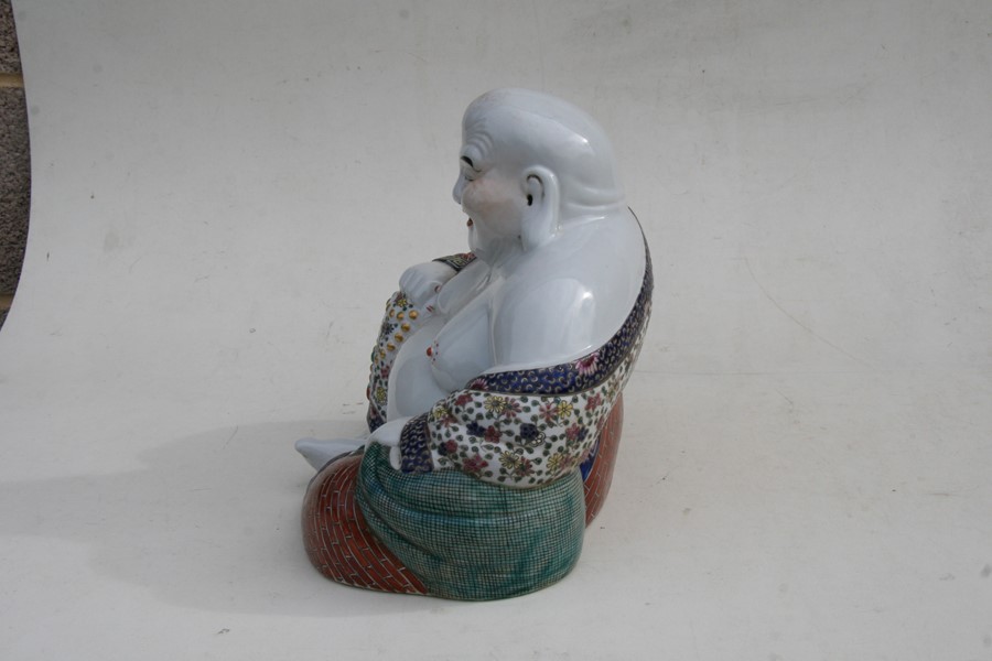 A Chinese famille rose figure in the form of a seated Buddha, impressed mark to underside, 26cms ( - Image 3 of 7