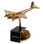 A brass model of the WW2 fighter bomber the De Havilland Mosquito with spinning propellers mounted