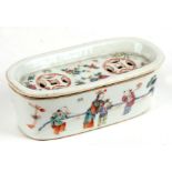 A Chinese famille rose potpourri box, the pierced cover decorated with scrolling flowers, the body