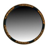 A circular bevel edged enamel framed wall mirror, 33.5cms (13.25ins) diameter.