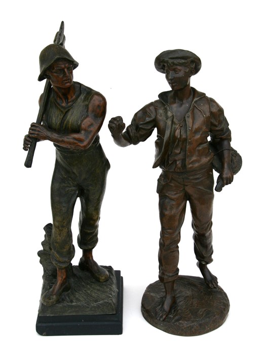 A large pair of bronzed spelter figures depicting peasants at work, 55cms (21.5ins) high.