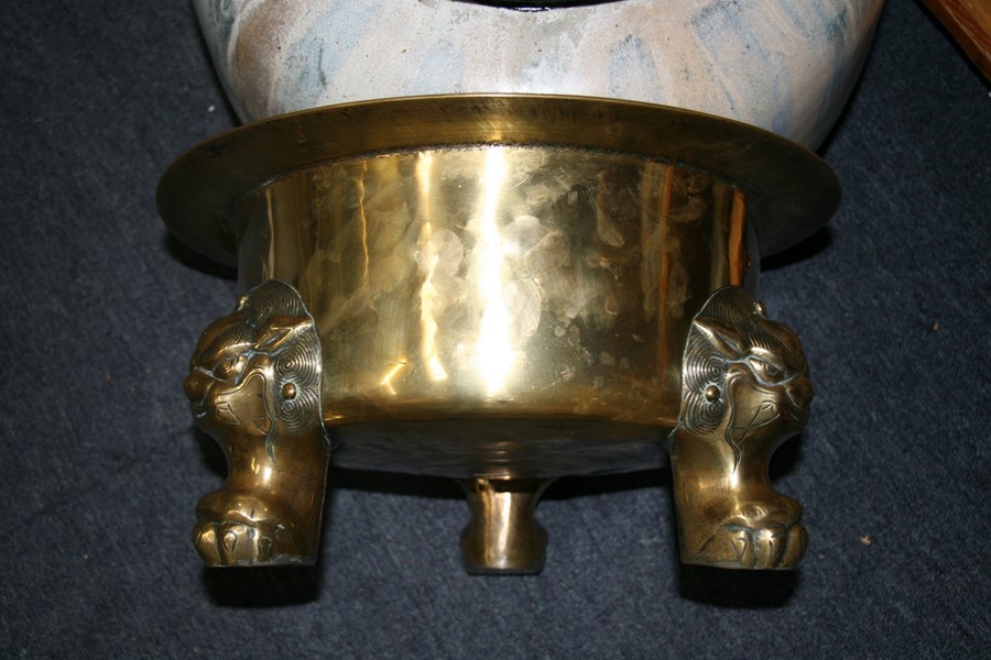 A large polished bronze Chinese censer on three lion mask paw legs, 39cms (15.25ins) diameter. - Image 6 of 7