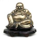 A Chinese large brass Buddha on hardwood stand, overall 25cms (9.75ins) high.
