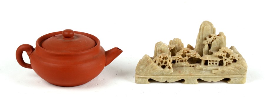 A Chinese yixing miniature tea pot. 5cm (2 ins) high together with a soapstone carving depicting a