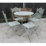 A green painted metal garden table and four matching chairs, the table 75cms (29.5ins) diameter.