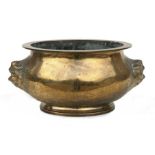 A Chinese large brass censer with lion mask handles and calligraphy, 27cms (10.5ins) diameter.