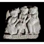 A large Asian / Cambodian stone temple carving depicting three figures, 60cms (23.5ins) wide.