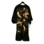 A 1930's Chinese Sing Fat Company embroidered silk robe decorated with dragons.