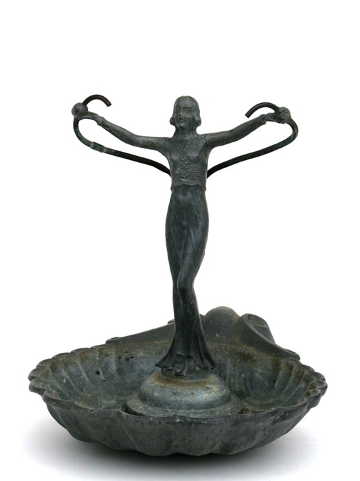 An Art Deco lead water feature depicting a young girl with out swept arms standing in a scallop