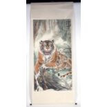 A large Chinese scroll painting depicting a tiger and cubs with calligraphy, 94 by 175cms (37 by