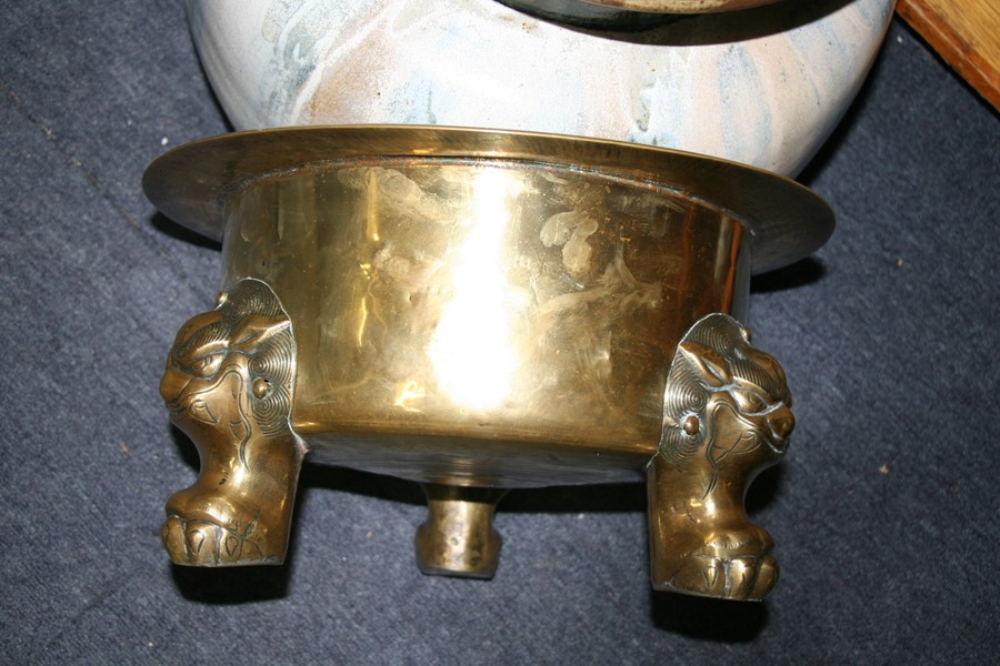 A large polished bronze Chinese censer on three lion mask paw legs, 39cms (15.25ins) diameter. - Image 2 of 7