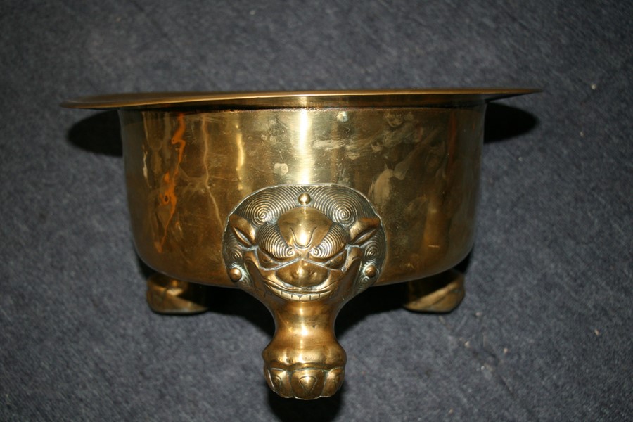 A large polished bronze Chinese censer on three lion mask paw legs, 39cms (15.25ins) diameter. - Image 5 of 7
