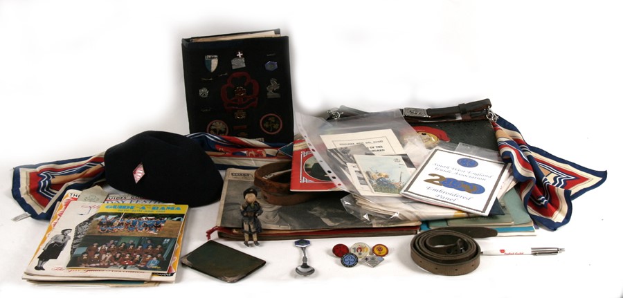 A large collection of items relating to the Girl Guides, including badges, post cards and