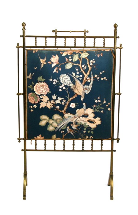 A Victorian Aesthetic Movement brass and textile fire screen, 62cms (24.5ins) wide.
