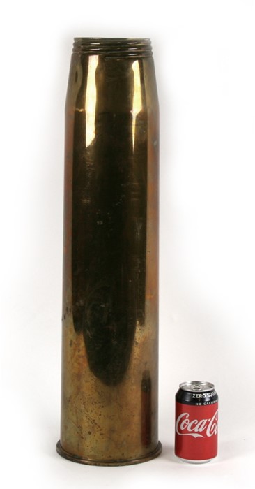 A huge brass shell case umbrella/stick stand. Diameter at the base 16.5cms (6.5ins) by 64cms (25.