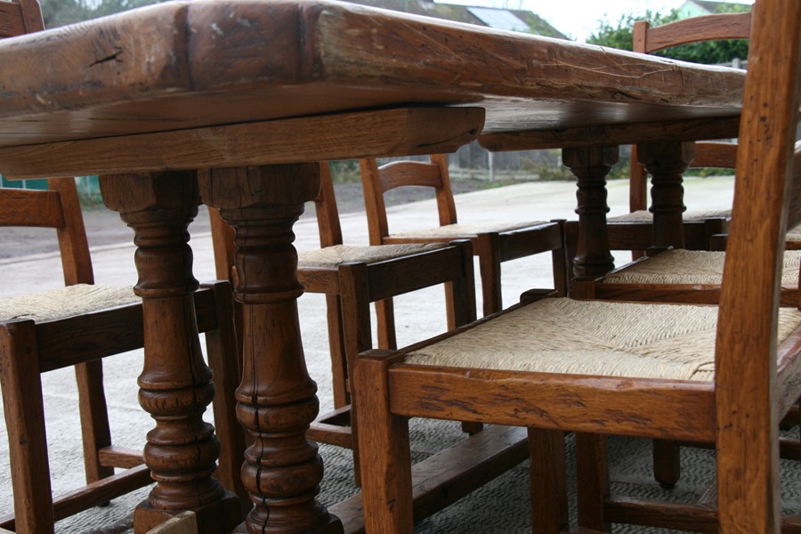 A solid oak refectory table on twin turned supports, 92 by 228cms (36 by 90ins); together with a - Image 3 of 5