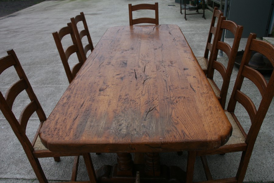 A solid oak refectory table on twin turned supports, 92 by 228cms (36 by 90ins); together with a - Image 5 of 5