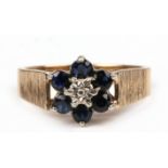 A 9ct gold sapphire and diamond cluster ring, approx UK size 'P'.
