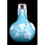 A miniature cameo glass vase by Thomas Webb & Sons; satin blue glass overlaid in opaque white, cut