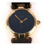 A ladies Must de Cartier wrist watch with plain black dial in silver gilt case no. 17 050343