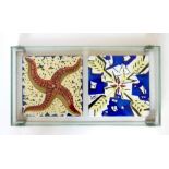 Two decorative ceramic tiles after Dali (1954) mounted in a glass display case Condition ReportA