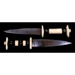 Tribal Art: Two Ethiopian daggers with ivory and ebony sectional handles. 25.5cm 10 inches.