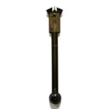 A mahogany cased stick barometer with brass face, fitted with a thermometer. Broken architectural