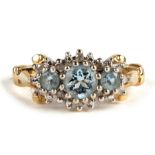 A 9ct gold diamond and topaz ring, Approx UK size L