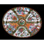 A 19th century Chinese famille rose oval meat plate decorated with figures, flowers, butterflies and