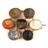 An early 19th century 18ct gold (tested) brooch of hexagonal form, set with a central hair panel