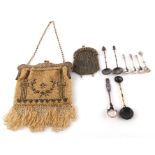 A German silver gilt mounted beaded purse; together with a group of spoons and other items.