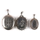 Three Victorian silver lockets. largest. 4cm (1.5 ins) high