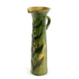 A green glazed Studio Pottery jug, 25cms (9.75ins) high.