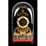 A brass skeleton clock with passing strike on a bell, eight day fusee movement. Velvet covered