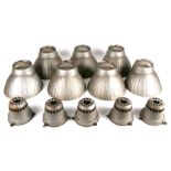 A set of seven Crompton mirrored glass pendant light shades with original metal galleries (one
