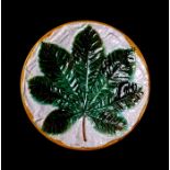 A 19th century George Jones majolica dish decorated with a horse chestnut leaf, 22cms (8.75ins)