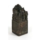A Chinese bronze seal surmounted with a dragon, four character mark to matrix, 11cms (4.25ins)