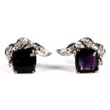 A pair of 14ct white gold earrings modelled as a flower, each set with a central square amethyst and