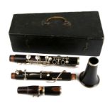A Victorian rosewood clarinet in five sections. Original black carry box.