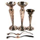 A pair of loaded silver trumpet vases; together with a similar smaller; a 14ct gold cased ladies
